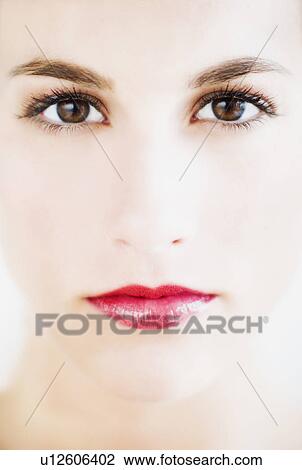 Stock Image - Studio portrait of young woman. Fotosearch