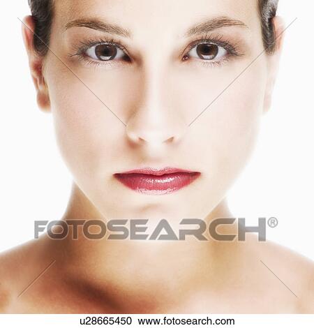 Stock Image - Studio portrait of young woman. Fotosearch