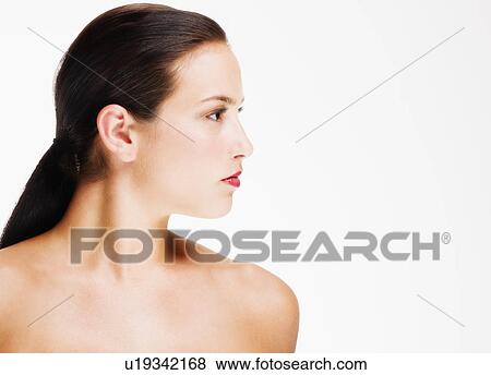 Stock Photo - Studio portrait of young woman. Fotosearch