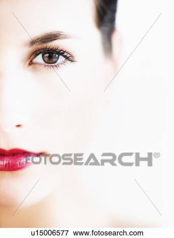 Stock Photo - Studio portrait of young woman with red lips. Fotosearch