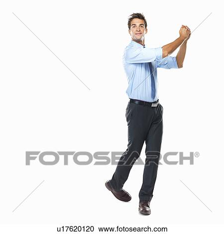 Stock Image - Studio shot of business man celebrating success. Fotosearch