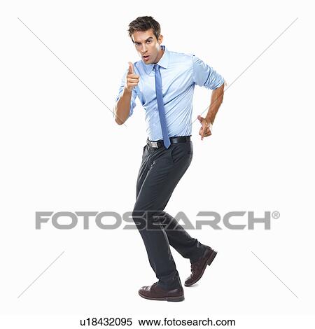 Stock Photography - Studio shot of business man making gun shaped hands and pointing at camera. Fotosearch