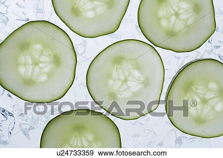 Stock Photo - Studio shot of cucumber slices. Fotosearch