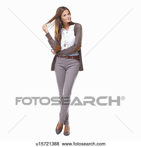 Studio shot of cute business woman playing with hair View Large Photo Image Stock Photo - Studio shot of cute business woman playing with hair. Fotosearch