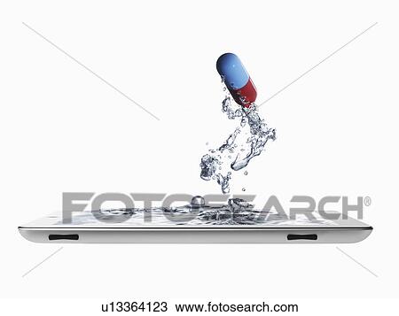 Studio shot of digital tablet with capsule View Large Photo Image Stock Image - Studio shot of digital tablet with capsule. Fotosearch