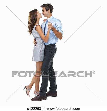 Studio shot of happy couple dancing View Large Photo Image Stock Image - Studio shot of happy couple dancing. Fotosearch