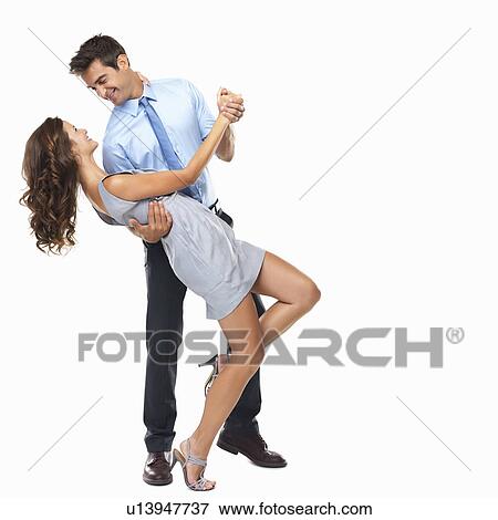 Stock Photo - Studio shot of happy couple dancing. Fotosearch