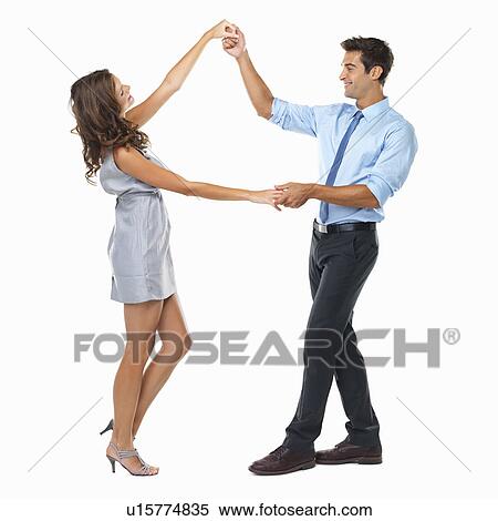 Stock Photography - Studio shot of happy couple dancing. Fotosearch