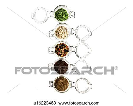 Stock Photo - Studio shot of jars with Mixed Seeds on white background. Fotosearch