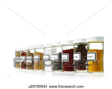 Picture - Studio shot of Jars with spices on white background. Fotosearch