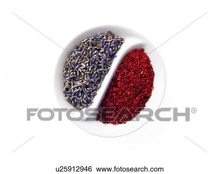 Stock Photograph - Studio shot of lavender flowers and paprika in Yin and Yang shape. Fotosearch