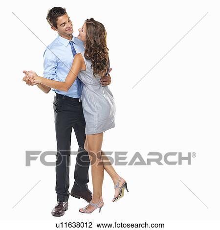 Stock Image - Studio shot of man and woman dancing. Fotosearch