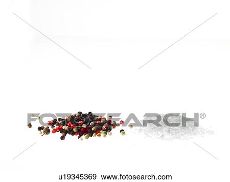 Stock Photo - Studio shot of mixed pepper corns and coarse salt. Fotosearch