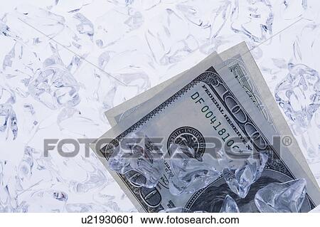 Studio shot of one hundred dollar bill between ice cubes View Large Photo Image Stock Image - Studio shot of one hundred dollar bill between ice cubes. Fotosearch