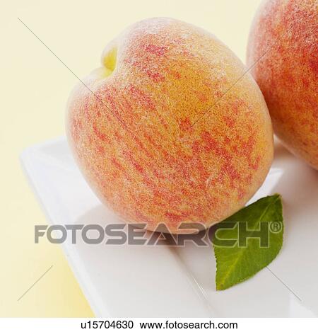 Stock Image - Studio shot of peaches. Fotosearch