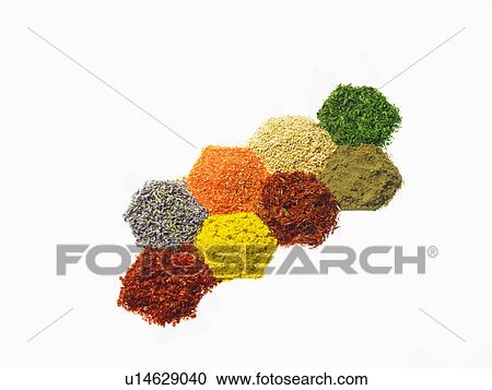 Stock Image - Studio shot of Piles of spice on white background. Fotosearch