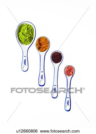 Stock Photograph - Studio shot of piles of spices on measuring spoons. Fotosearch