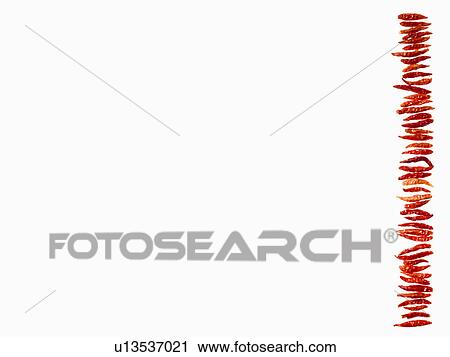 Stock Image - Studio shot of Red Chili Peppers on white background. Fotosearch