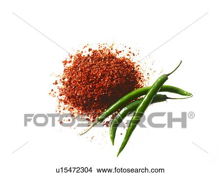 Picture - Studio shot of Red Chili Powder and Whole Green Chilies on white background. Fotosearch