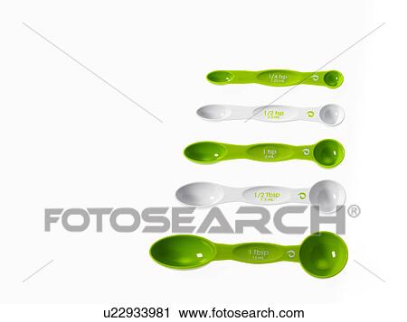 Stock Image - Studio shot of row of green measuring spoons. Fotosearch