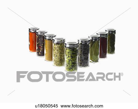 Stock Photography - Studio shot of row of jars with spices. Fotosearch