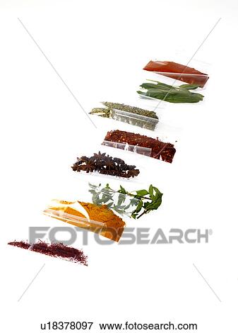 Stock Photo - Studio shot of row of packets with spices. Fotosearch