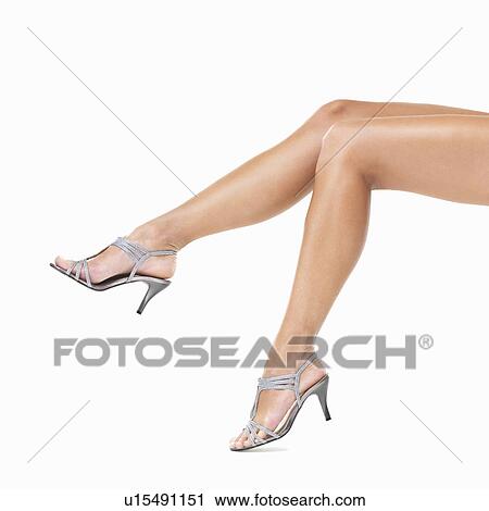 Studio shot of woman's legs wearing sexy sandals View Large Photo Image Stock Image - Studio shot of woman's legs wearing sexy sandals. Fotosearch