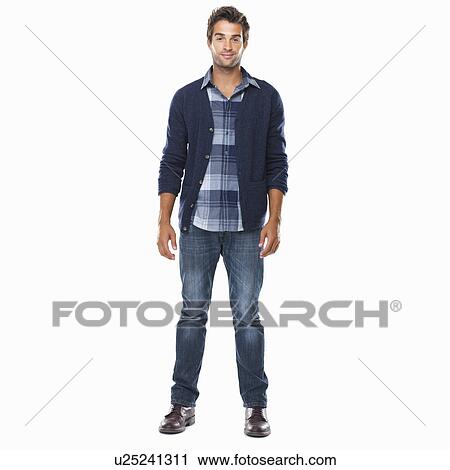 Studio shot of young confident man standing on white background and smiling View Large Photo Image Stock Image - Studio shot of young confident man standing on white background and smiling. Fotosearch