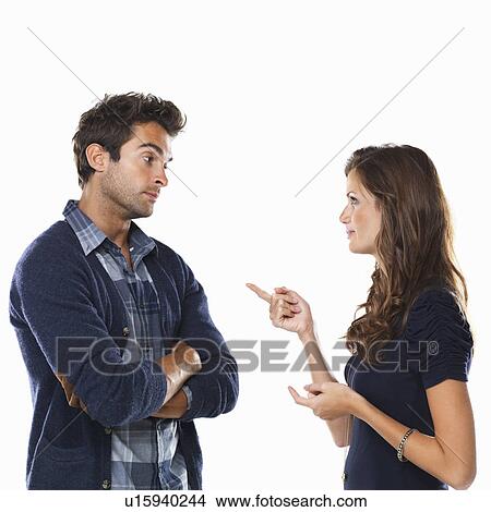 Studio shot of young couple having argument View Large Photo Image Picture - Studio shot of young couple having argument. Fotosearch