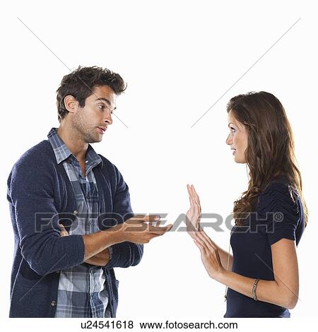 Studio shot of young couple having argument and gesturing View Large Photo Image Stock Photo - Studio shot of young couple having argument and gesturing. Fotosearch