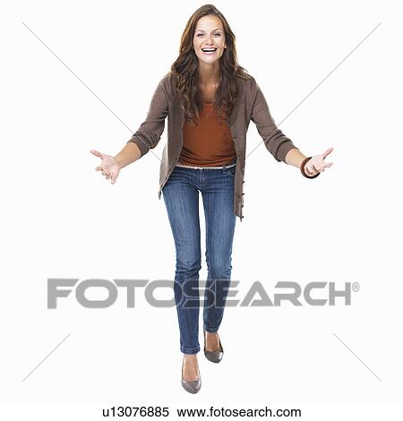 Stock Photography - Studio shot of young enthusiastic woman smiling. Fotosearch