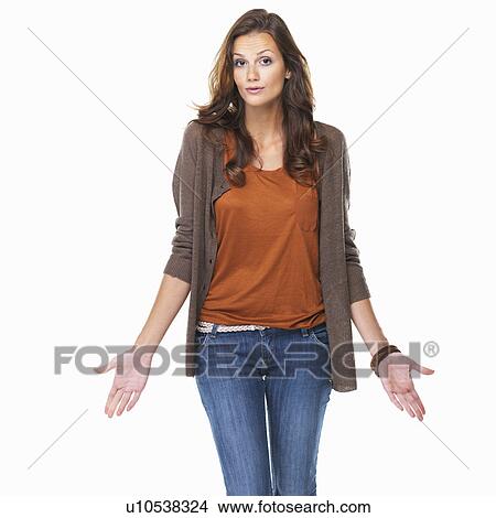 Studio shot of young woman shrugging her shoulders View Large Photo Image Picture - Studio shot of young woman shrugging her shoulders. Fotosearch