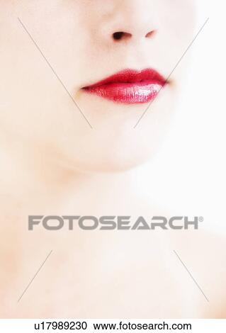 Studio shot of young woman wearing red lipstick View Large Photo Image Stock Image - Studio shot of young woman wearing red lipstick. Fotosearch