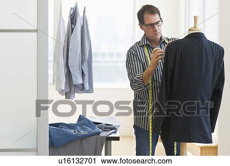 Tailor at work View Large Photo Image Stock Image - Tailor at work. Fotosearch