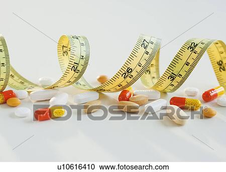 Tape measure, pills and capsules, studio shot View Large Photo Image Stock Image - Tape measure, pills and capsules, studio shot. Fotosearch