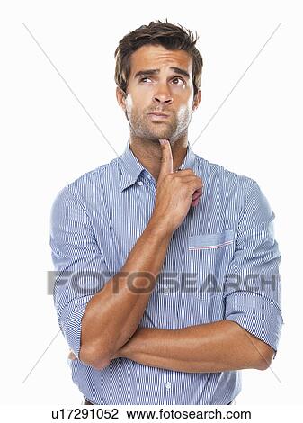 Stock Image - Thoughtful business man with finger on chin looking away. Fotosearch