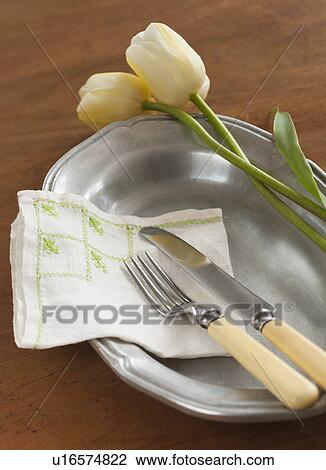 Tulips on plate with cutlery View Large Photo Image Stock Image - Tulips on plate with cutlery. Fotosearch