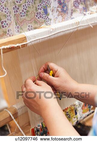 Stock Photograph - Turkey, Ephesus, Woman's hands weaving Turkish rug. Fotosearch