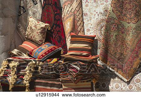 Picture - Turkey, Istanbul, Grand Bazaar, rugs and cushions for sale. Fotosearch