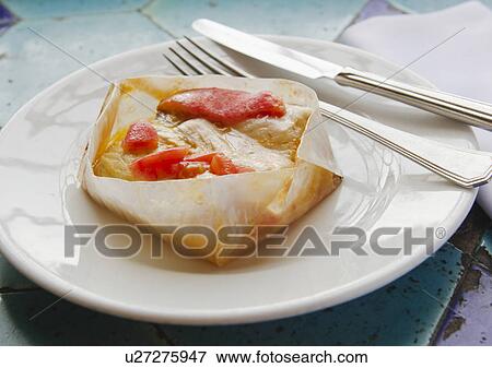 Stock Photo - Turkey, Istanbul, Sea Bass cooked in parchment. Fotosearch