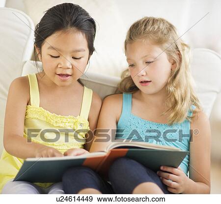 two girls (6-9) reading book View Large Photo Image Stock Photo - two girls (6-9) reading book. Fotosearch