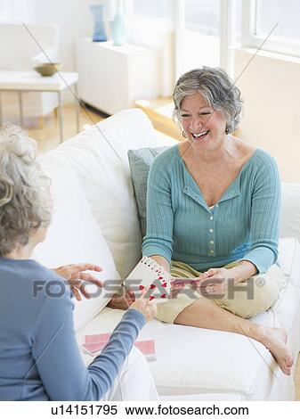 Two senior women playing cards View Large Photo Image Stock Photography - Two senior women playing cards. Fotosearch