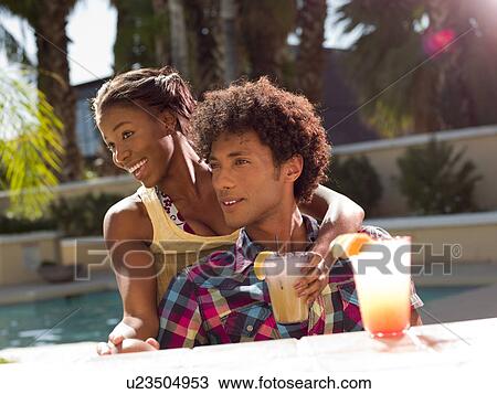 USA, Arizona, Scottsdale, Young couple at pool side bar View Large Photo Image Stock Image - USA, Arizona, Scottsdale, Young couple at pool side bar. Fotosearch