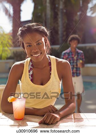 USA, Arizona, Scottsdale, Young couple at pool side bar View Large Photo Image Stock Photograph - USA, Arizona, Scottsdale, Young couple at pool side bar. Fotosearch