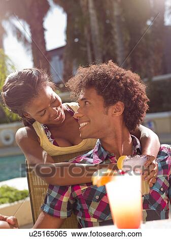USA, Arizona, Scottsdale, Young couple at pool side bar View Large Photo Image Stock Photography - USA, Arizona, Scottsdale, Young couple at pool side bar. Fotosearch