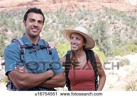 USA, Arizona, Sedona, Young couple hiking, man holding map View Large Photo Image Stock Image - USA, Arizona, Sedona, Young couple hiking, man holding map. Fotosearch