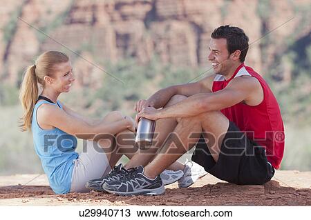 USA, Arizona, Sedona, Young couple enjoying view in desert after hiking View Large Photo Image Stock Image - USA, Arizona, Sedona, Young couple enjoying view in desert after hiking. Fotosearch