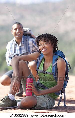 USA, Arizona, Sedona, Young couple hiking and enjoying desert scenery View Large Photo Image Stock Photo - USA, Arizona, Sedona, Young couple hiking and enjoying desert scenery. Fotosearch