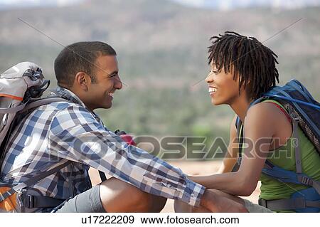 USA, Arizona, Sedona, Young couple hiking and enjoying desert scenery View Large Photo Image Stock Photo - USA, Arizona, Sedona, Young couple hiking and enjoying desert scenery. Fotosearch