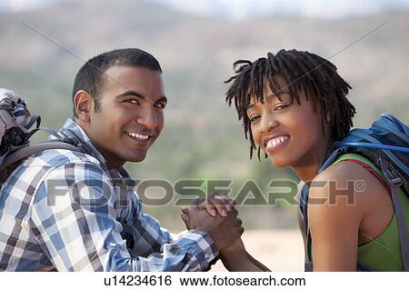 USA, Arizona, Sedona, Young couple hiking and enjoying desert scenery View Large Photo Image Stock Photograph - USA, Arizona, Sedona, Young couple hiking and enjoying desert scenery. Fotosearch